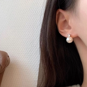 Elegant pearl stud earrings with zircon accents in silver setting for women