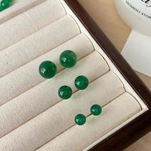 Vintage green chalcedony stud earring set with three sizes of round beads in a jewelry box