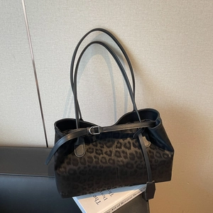 Large black leopard print tote bag with leather texture and thin adjustable shoulder straps