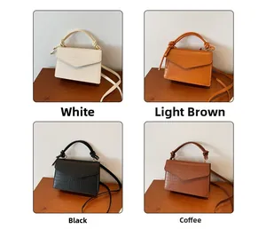 Detail showing four colors of crocodile texture envelope bags with knotted handles