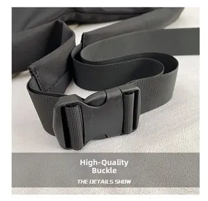 Detail shot of the durable black plastic buckle and nylon strap on a crossbody bag