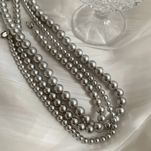 Close-up of S925 sterling silver clasp and multi-layer silver-grey pearl necklace