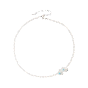 Minimalist white beaded choker necklace with delicate blue-centered flower accents