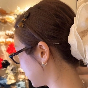 Chic silver layered hoop earrings with oversized white fabric flower hair accessory
