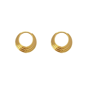 Detailed view of golden hoop earrings with layered ribbed texture and crescent design
