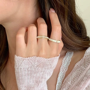 Elegant gold stacked pearl ring set with white enamel floral band for women