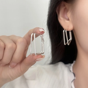 Silver geometric double-layer rectangular hoop earrings for women shown worn as a close-up