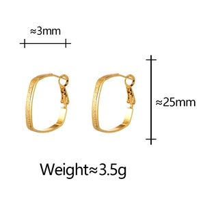 Detail view of rectangular gold matte earrings with textured finish and dimensions