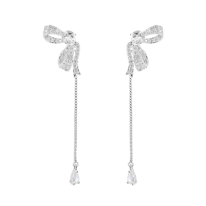 Elegant silver bow earrings with zircon stones and long tassel drop pendants on white background