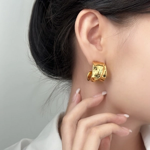 Elegant gold irregular C-shape earrings for women with a high-polished metallic finish
