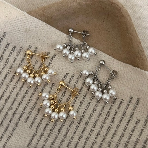Orecchini vintage con perle e nappine in oro e argento con design a ventaglio elegante