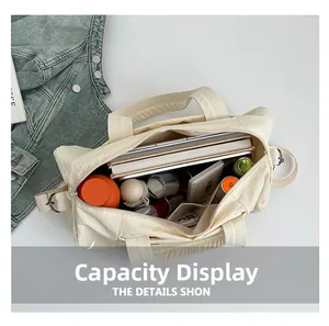 Capacity display of large nylon tote bag showing books, water bottle and essentials