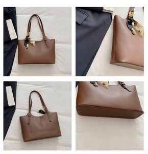 Detail view of a brown leather tote bag with elegant silk scarf and large capacity