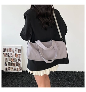 Nylon gym bag in lavender with adjustable shoulder strap and large capacity on model