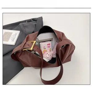 Detailed interior view of a brown vintage tote showing large capacity for essentials