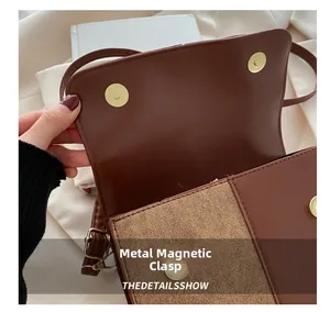 Makro-Detail der goldenen Magnetschnallen an einer Patchwork-Umhängetasche aus Leder