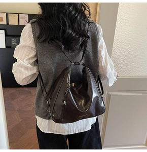 Macro detail of dark brown glossy patent leather bag with Fashion & Bags text logo