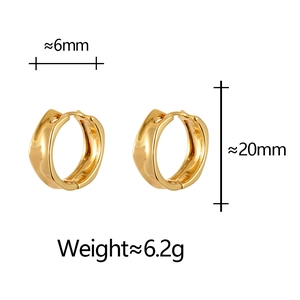 Detail view of irregular gold earrings with 6mm width and 20mm height dimensions