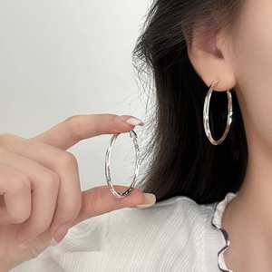 Chic silver hoop earrings with geometric facets for women, luxury polished finish