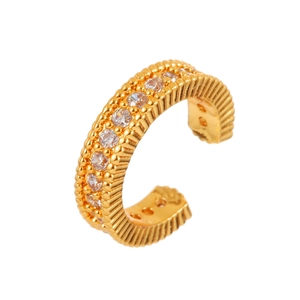 Minimalist gold ear cuff with textured stripes and sparkling cubic zirconia stones