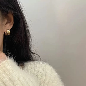 Minimalist gold triple-layered hoop earrings for women with a sleek geometric metal design