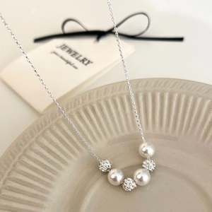 Elegant French vintage necklace with pearls and crystal pavé spheres on a silver chain