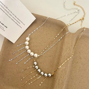 Collier à pampilles en perles vintage français en finitions élégantes or et argent