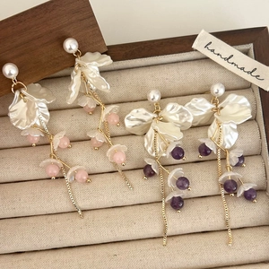 Elegant pearl and crystal flower petal tassel earrings in pink and purple colors