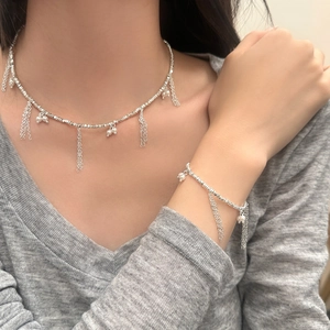 Silver fringe tassel necklace and bracelet set with pearl accents on model