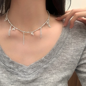 Elegant silver tassel pearl necklace for women featuring shimmering beads and dangling fringe
