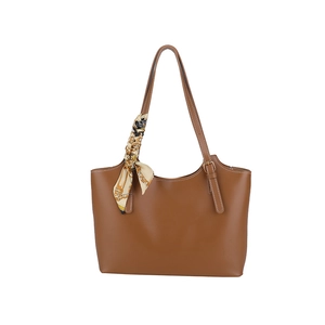Brown leather tote bag with white contrast stitching and decorative horse-pattern silk scarf