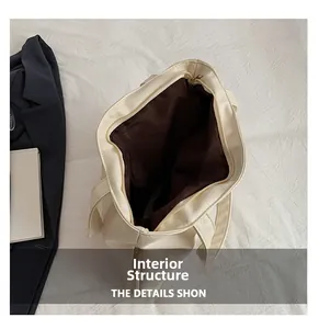 Detail of internal structure with brown lining and secure metal zipper closure