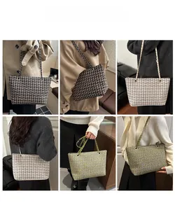Detail view of plaid tweed tote bags with chain straps in various colors for women