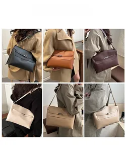 Close-up of elegant leather shoulder bags in five colors with metal buckle details
