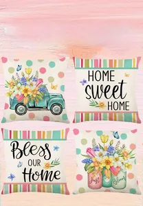 Detail of four spring floral cushion covers with truck and flower jar prints on pink wood