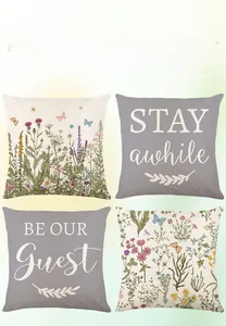 Set of four spring floral cushion covers featuring script quotes and botanical prints