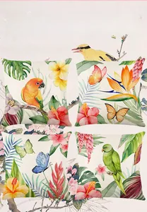 Detail of four pillow covers featuring colorful parrots, butterflies and tropical flowers