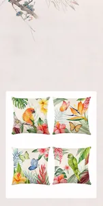 Detail of floral and bird print cushion covers featuring parrots and tropical hibiscus