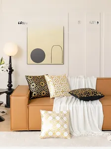 Detail of geometric hot stamping on plush black and white sofa pillow covers