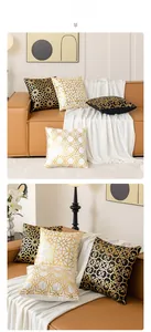 Detail of geometric gold foil patterns on luxury plush pillow covers in black and white