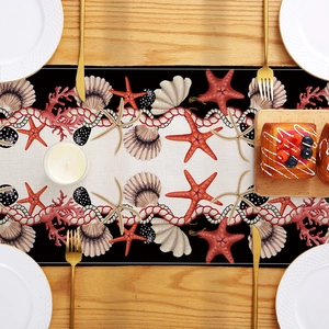Marine life table runner featuring starfish and shells on a wooden dining table