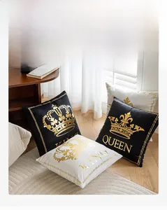 Macro detail of gold foil crown and King Queen lettering on soft velvet pillowcase