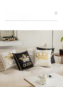 Detail of King and Queen gold foil crown prints on black and white plush pillowcases