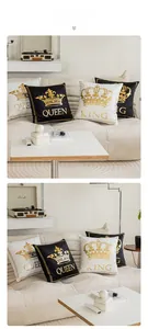 Detail of King and Queen gold crown prints on black and white plush velvet pillow covers