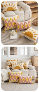 Detailed view of tufted throw pillow case with yellow abstract sun and tassel edges