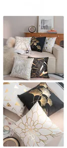 Detail of gold foil ginkgo leaves and geometric patterns on soft plush pillowcase