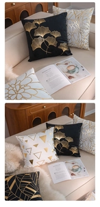 Macro detail of gold foil leaf and geometric patterns on soft velvet cushion covers