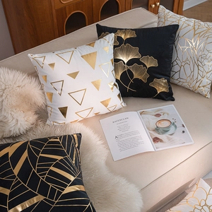 Modern black and white pillow covers with gold foil geometric and leaf patterns