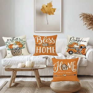 Set of four autumn harvest pumpkin pillow covers on sofa for Thanksgiving home decor