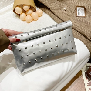 Silver metallic envelope clutch bag with rivet studs and magnetic snap closure